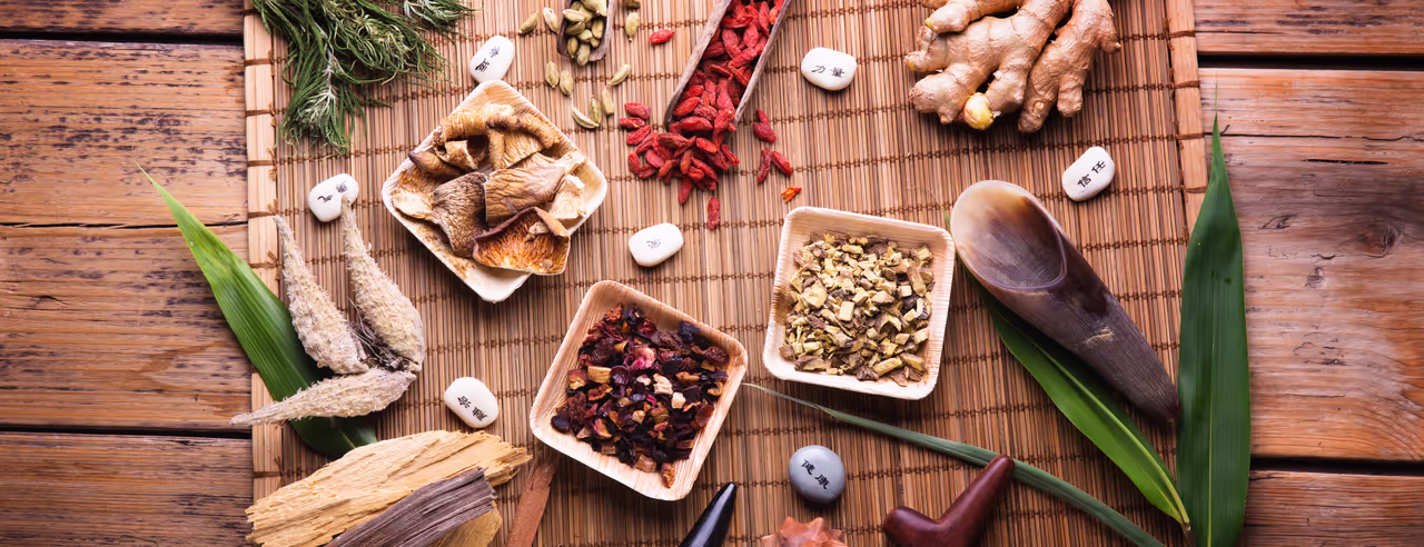A selection of herbs on a bamboo base.