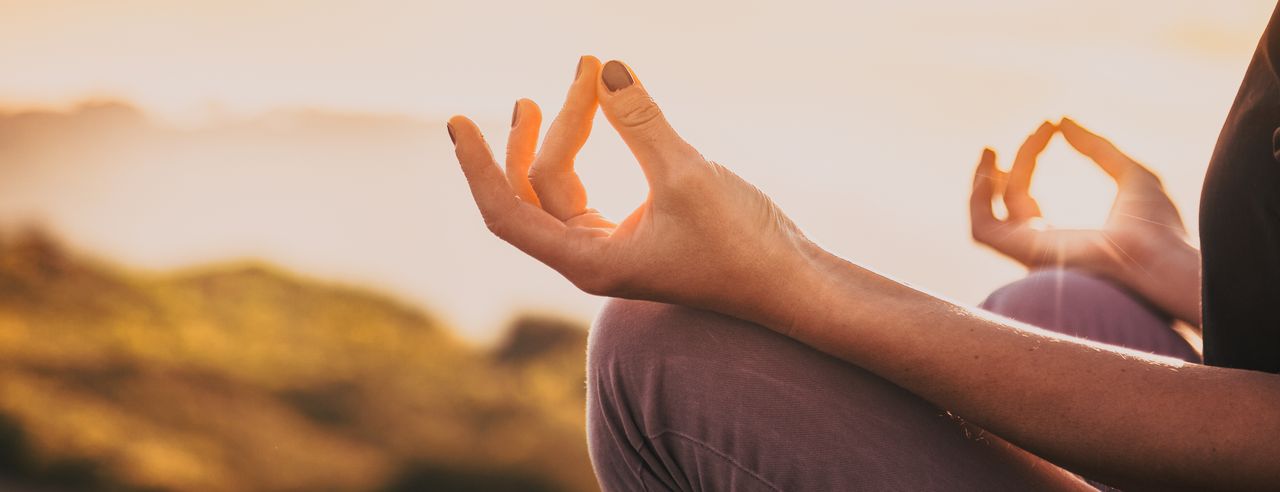 A woman meditates calmly and mindfully to combat her depression