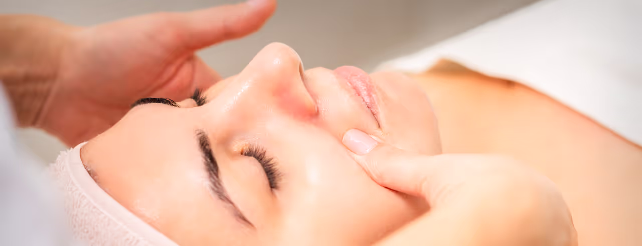 Manual lymphatic drainage on a woman's face
